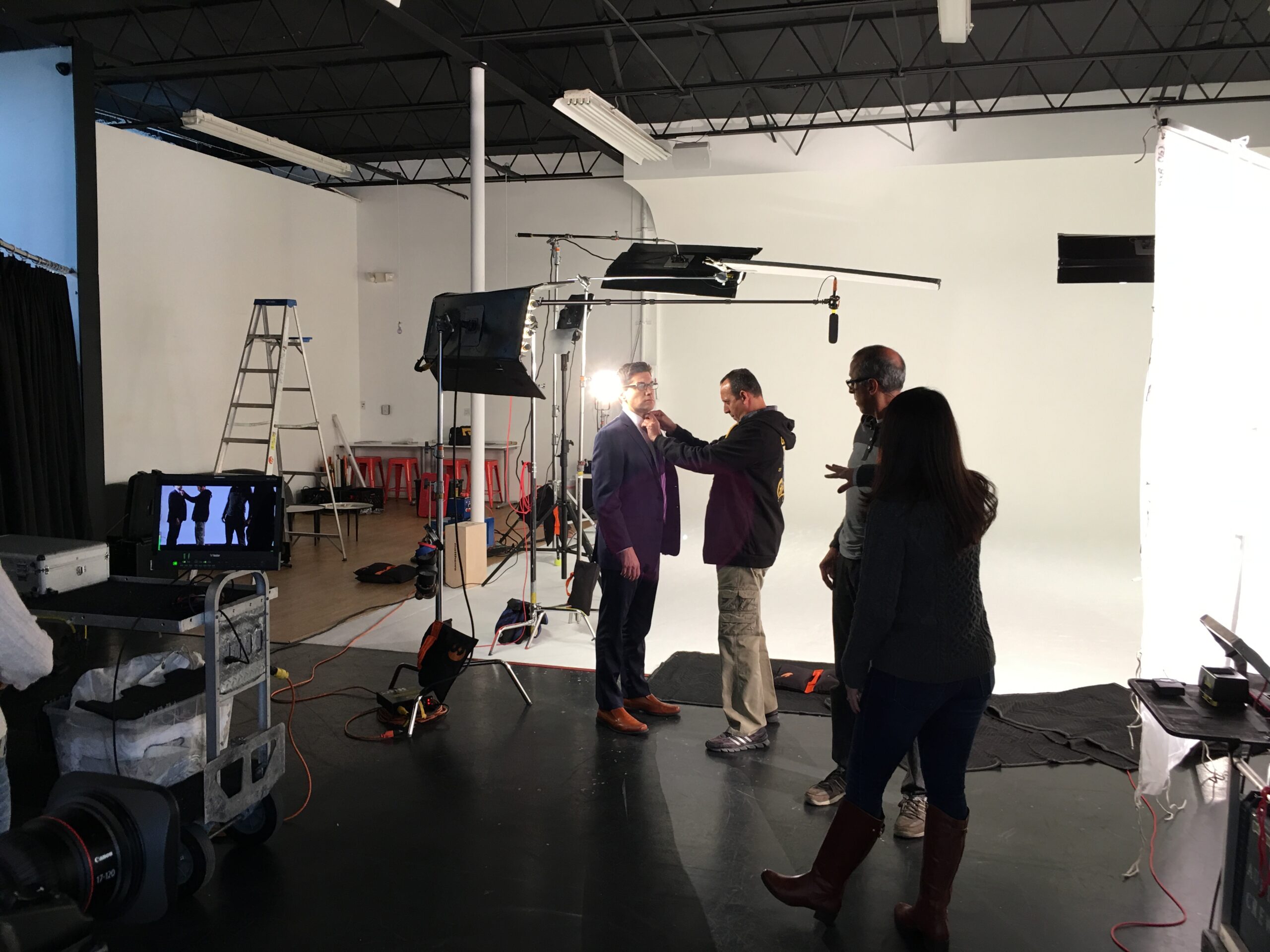 NBC 6 Weather Promo Studio setup with crew dressing an actor, lights and camera shown in the scene.